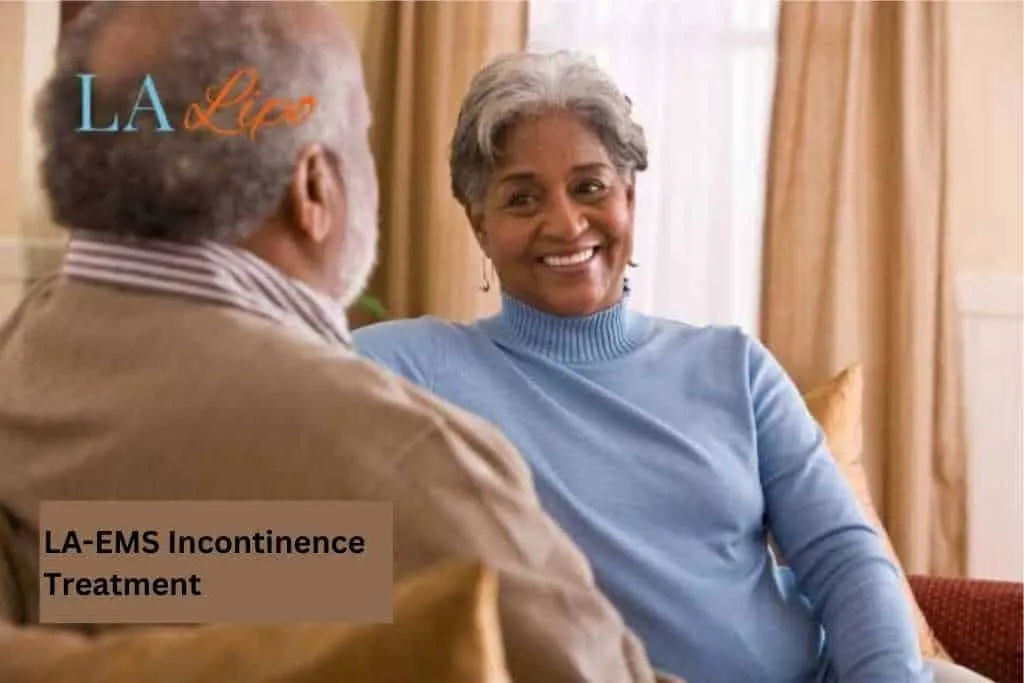 Couple sat smiling at each other - LA-EMS treatment Wembley