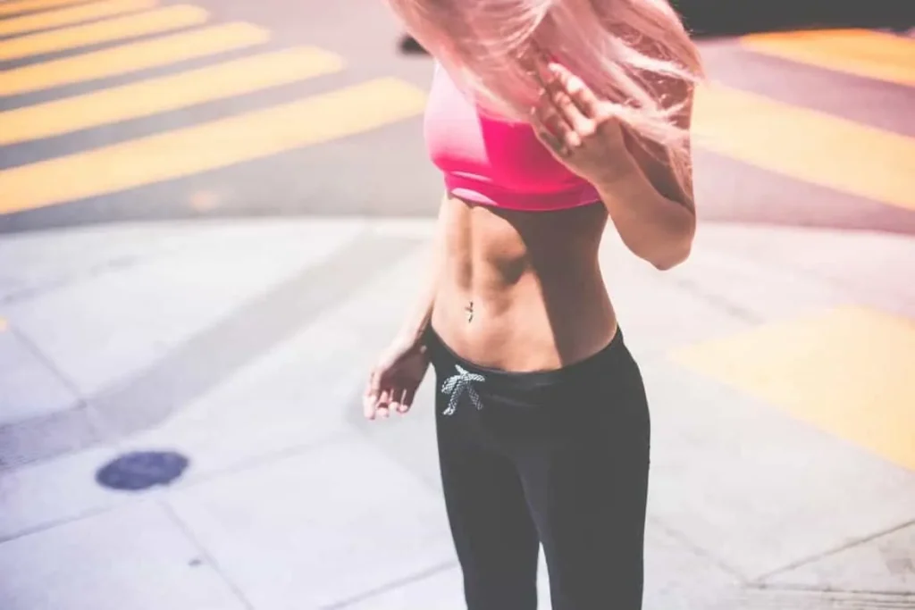 Woman with toned stomach after LA-EMS Body Sculpting Treatment Wembley